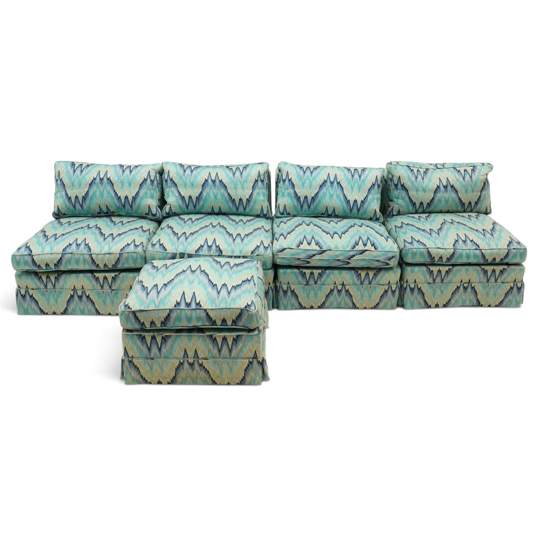 Parker & Farr - 1970s modular sofa suite comprising four chairs and footstool, reclined back with loose seat cushion, upholstered in turquoise flame-stich fabric with skirt, on castors