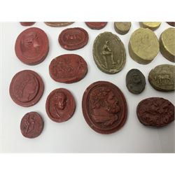 Large and impressive collection of Grand Tour cameos and intaglios (impronte), mostly red plaster examples
