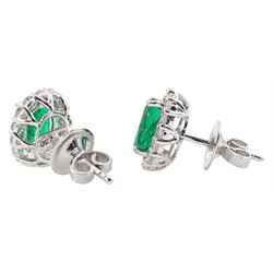 Pair of 18ct white gold oval emerald and round brilliant cut diamond cluster stud earrings, stamped 18K, total emerald weight approx 2.50 carat, total diamond weight approx 0.75 carat