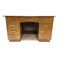 Mid 20th century oak twin pedestal office desk, fitted with eight drawers