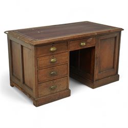 Early 20th century pitch pine twin pedestal desk, the rectangular top with inset gilt tool...