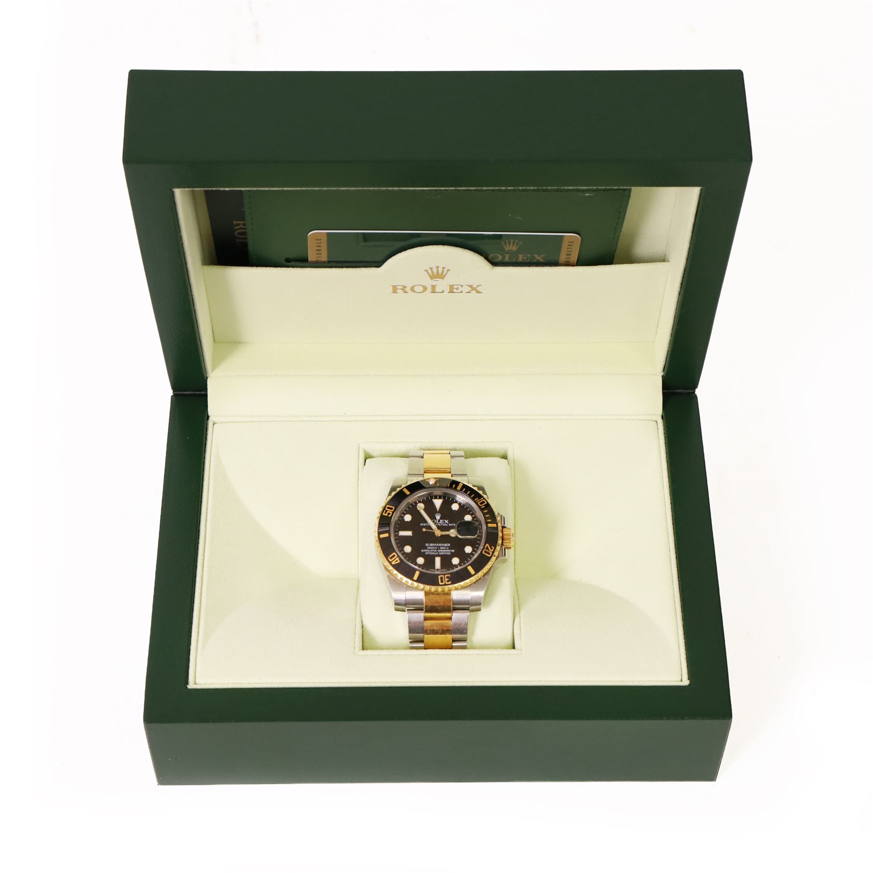 Rolex Oyster Perpetual Submariner Date gentleman's stainless steel and gold automatic wristwatch, Ref. 116613LN, serial No. 8201P7C5, back dial with luminous hour markers, unidirectional rotating black ceramic bezel, on stainless steel and yellow gold Rolex Oyster bracelet with fold-over clasp, boxed with guarantee card dated 2013