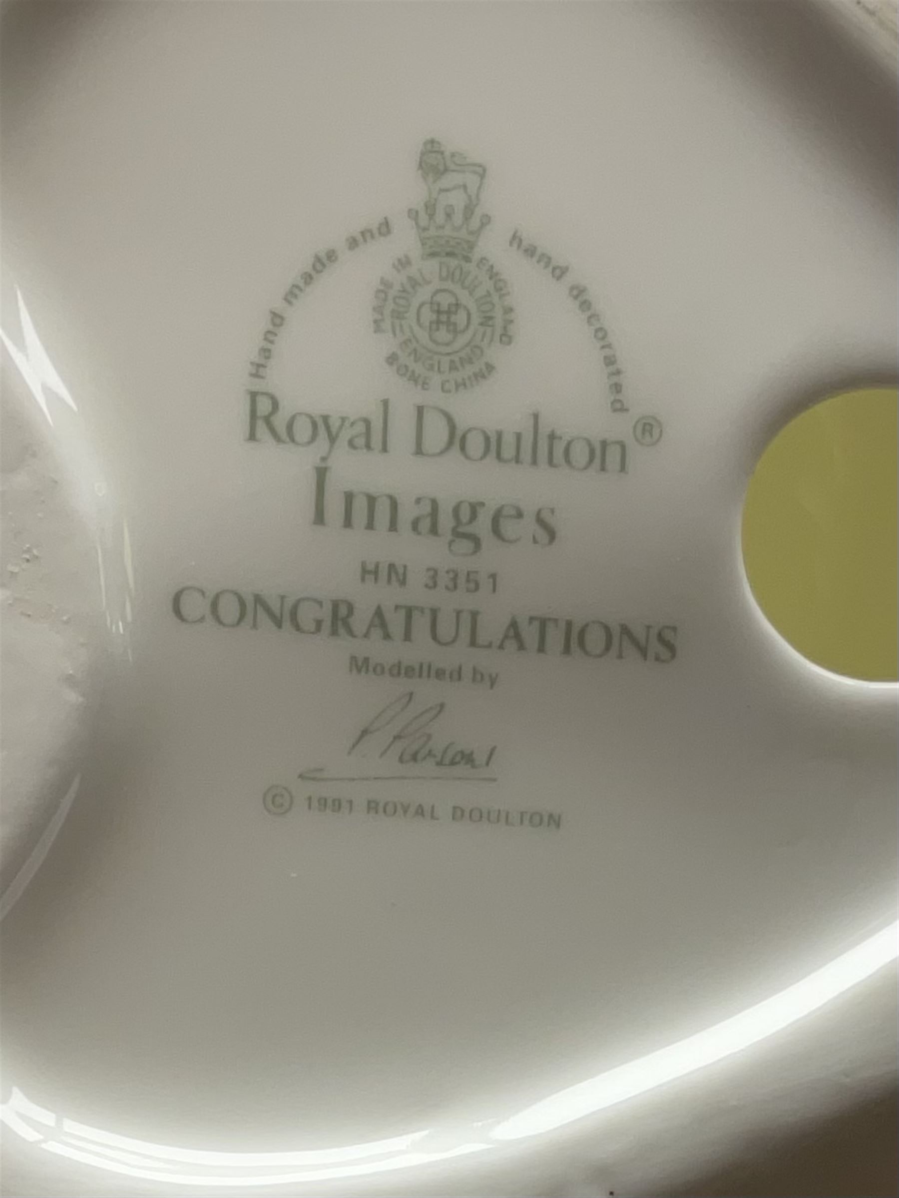 Four Royal Doulton Images figures comprising 'Happy Anniversary', 'Wedding Day', 'Congratulations' and 'Carefree', together with a set of three Heinrich collectors plates depicting Fairies.