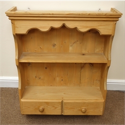  Solid pine dresser, projecting cornice, two tier plate rack, four drawers above four cupboards, plinth base (W182cm, H192cm, D48cm) and a wall hanging unit, single shelf, two drawers (W64cm, H82cm, D20cm) (2)  