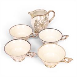 Jacob Hertel Bavarian tea service, decorated with silvered overlay of birds in foliage, comprising teapot, milk jug, covered sucrier three cups and saucers 