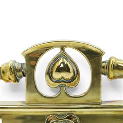 Two Edwardian brass fire curbs, comprising a decorative example with pierced vertical frieze, applied Tulips (H 21cm, W 126cm, D 32cm), together with a hammered moulded example with acanthus corners (H 12cm, W 138cm, D 37cm)