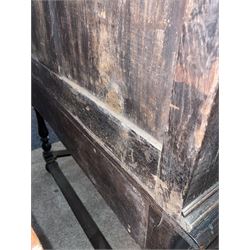 17th century oak chest on stand, moulded cornice over block work frieze, the upper section fitted with three long drawers each decorated with applied geometric mouldings and faceted panels, panelled sides with moulded frame, the stand fitted with two drawers, on five turned supports united by plan flat stretchers, terminating to turned feet