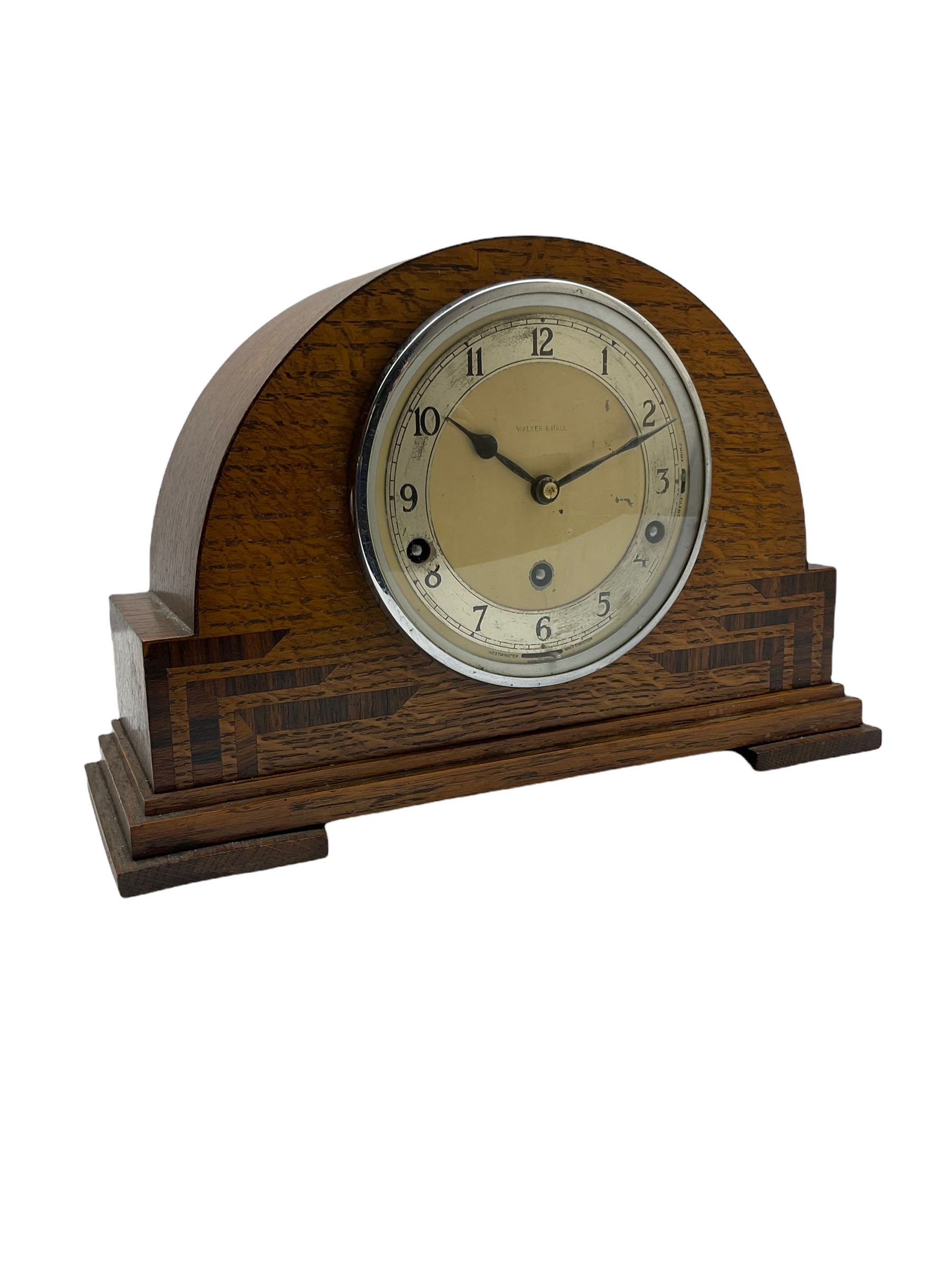 An English chiming mantle clock by Walker & Hall in an arched oak case