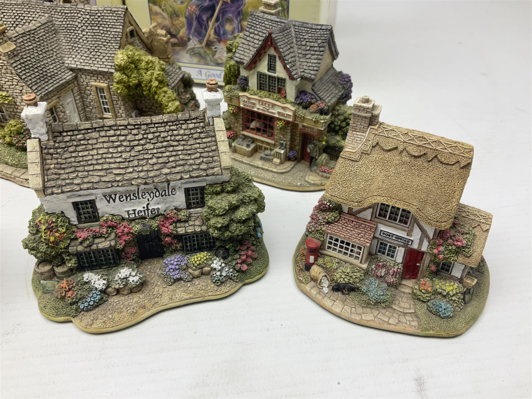 Twenty three Lilliput Lanes, including Village School, Lace's Shoe Shop, Cockles & Muscles, Scotland the Brave etc, together with The Leonardo Collection Paint Box Poppets and Gullivers World magazines 