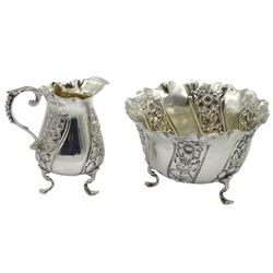 Edwardian silver sugar bowl and matching milk jug, with embossed foliate and floral decoration by Walker & Hall, Sheffield 1903, approx 6.4oz
