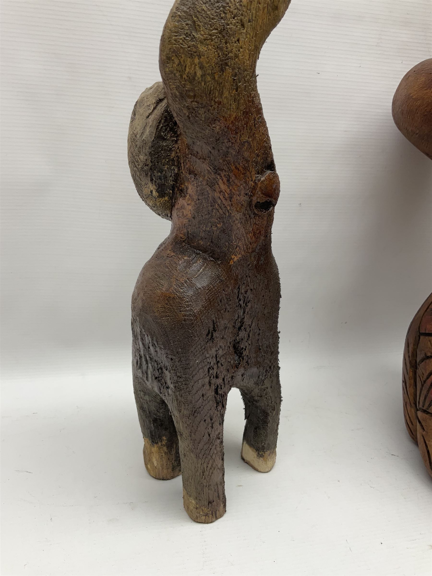 Helen Skelton (British 1933 – 2023): Three carved wooden abstract sculptures, each modelled as a cat, with carved or painted features, largest H63cm. Born into an RAF family in 1933 in Kent and travelled the world extensively during her childhood. After settling in Bridlington, Helen immersed herself in painting, textiles, and wood sculpture, often inspired by nature's beauty. Her talent was showcased in a one-woman show at Sewerby Hall and recognised with the sculpture prize at Ferens Art Gallery in 2000. Sadly, Helen’s daughter passed away from cancer in 2005. This loss inspired Helen to donate her sculptures to Marie Curie upon her passing in 2023.