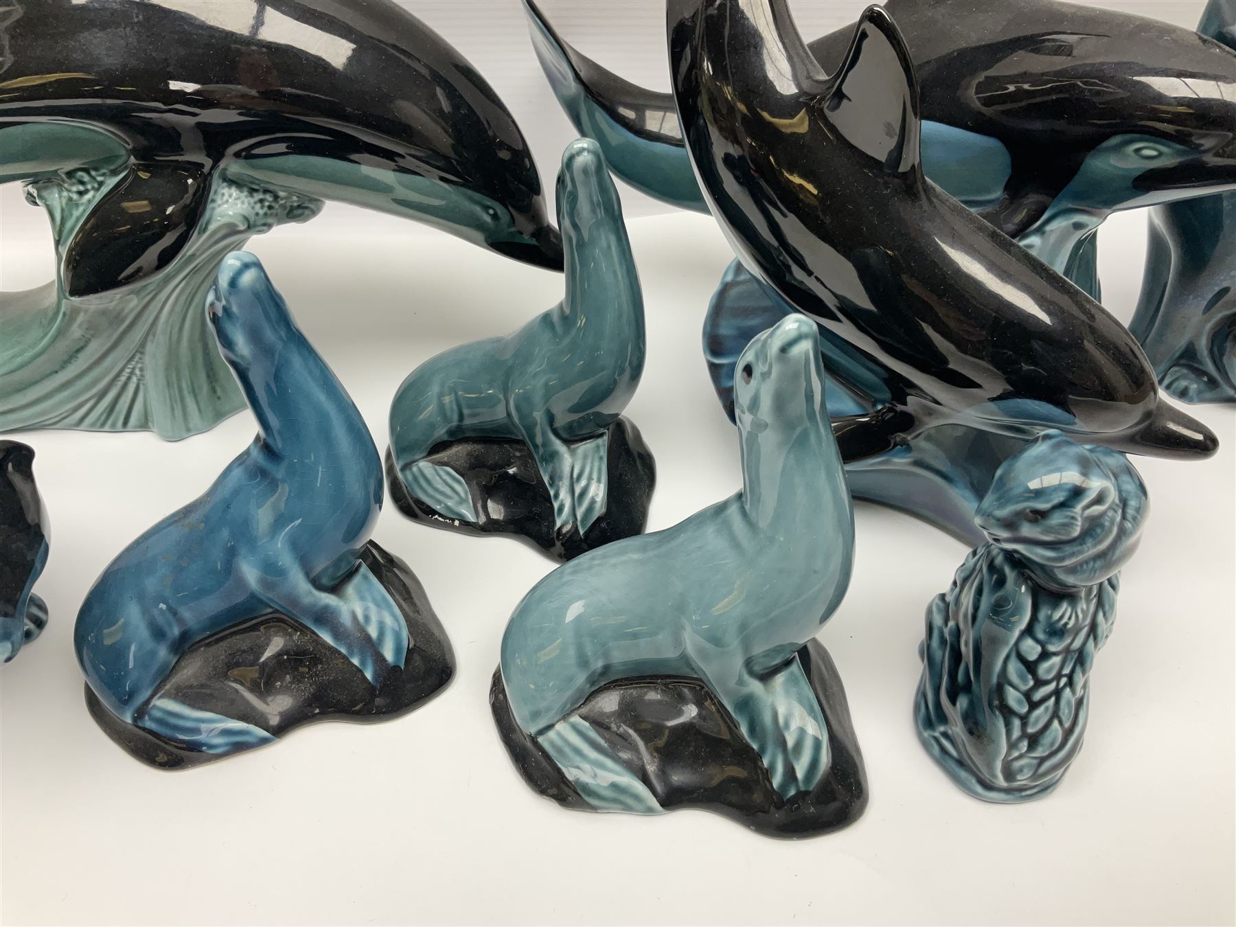 Collection of Poole pottery animals, including frogs, owls, otters, dolphins, mice etc, all with printed mark beneath (23)