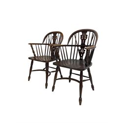 Pair late 20th century oak Windsor elbow chairs, double hoop and stick back with pierced and fretwork work splat, dished seat on turned supports joined by crinoline stretcher