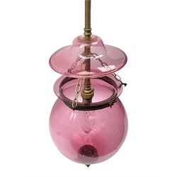 Late Victorian cranberry glass ceiling shade, of bulbous form with domed cover and metal mounts, shade without cover H30cm
