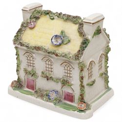 19th century pottery money box in the form of a two storey house with applied floral decoration W14cm  and six pottery cottage pastille burners