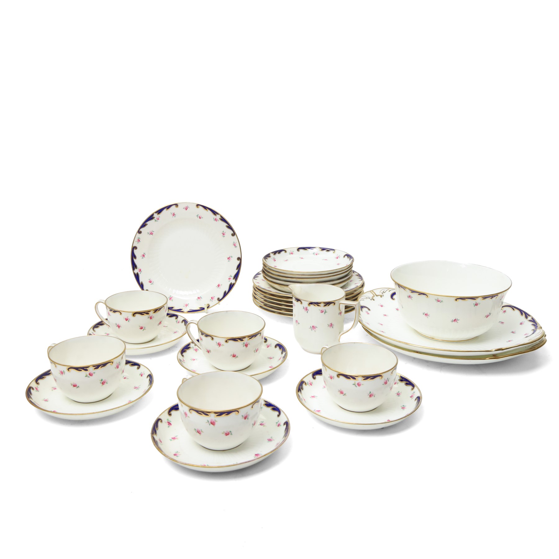 Wedgwood tea service decorated with floral sprays within a blue and gilt border comprising five cups, ten saucers, seven plates, two bread and butter plates, milk jug and sugar bowl