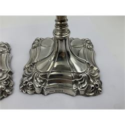 Pair of late Victorian silver mounted candlesticks, each of knopped and part fluted form, upon square stepped base with anthemions to each corner, with conforming sconces, hallmarked to removable sconces and foot, Thomas A Scott, Sheffield 1901, H25.2cm
