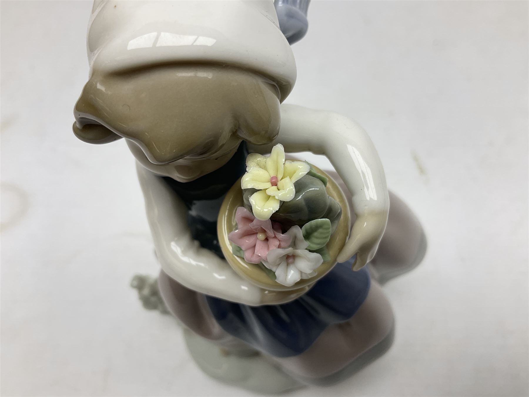 Three Lladro Flower Girls figures, comprising Sweet Scent no 5221, Pretty Pickings no 5222 and Spring is Here no 5223, largest example H18cm 