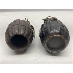 Two inert WW2 Mills Bomb (pineapple) hand grenades; one adapted as a money box with coin slit to the side and later cap H9.5cm (2)