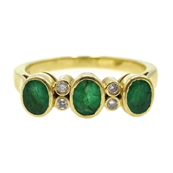  Gold three stone emerald and four stone diamond ring, stamped K18  