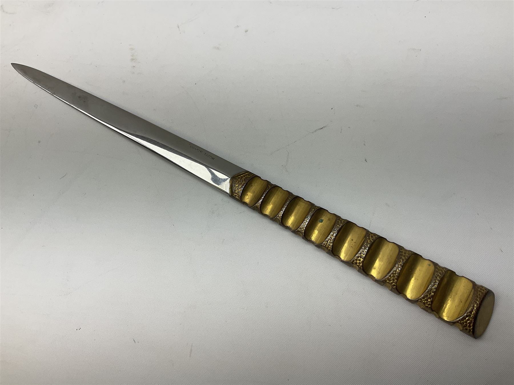 Malayan Kris dagger, the 31.5cm double edged straight heavy damascus blade with copper ferrule; carved hardwood grip; in large wooden throated scabbard with floral decorated white metal covering L47.5cm overall; a kris blade with adapted antler grip; and five various small daggers/letter openers (7)