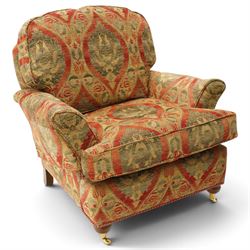 Duresta - traditional shape armchair with out-swept arms, upholstered in crimson ground fabric decorated with palmettes and foliate motifs with matching loose and scatter cushions, raised on compressed bun feet with brass cups and castors
