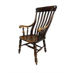 Late 19th century elm farmhouse armchair, high lath back raised on turned supports united by stretcher