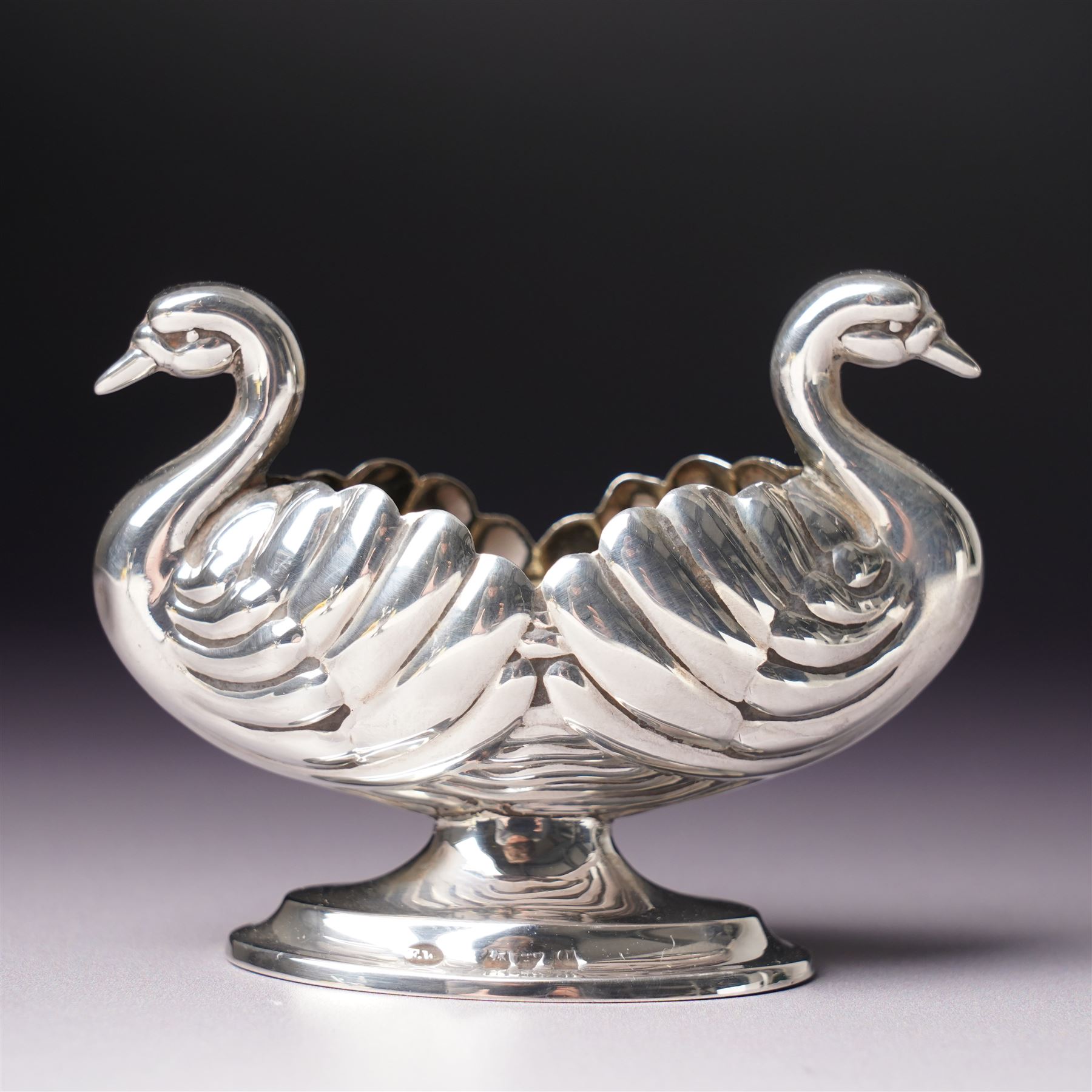 Pair of Victorian silver double headed Swan shape salts L7cm Chester 1897 Maker Florence Warden together with a pair of plated spade shape spoons 