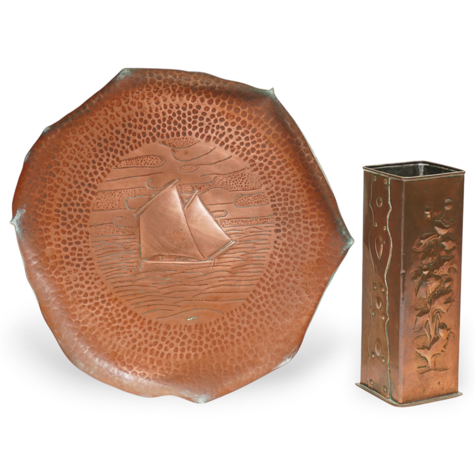 Newlyn Arts and Crafts copper square section vase with flowers and strapwork decoration H21cm and a Newlyn beaten copper circular tray with raised rim and centre panel of a yacht D28cm, both stamped 'Newlyn' (2)