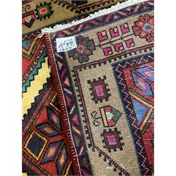 Persian red ground runner, set with seven linked geometric medallions, decorated all over with geometric stylised plant and flower motifs 