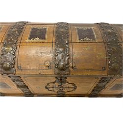 19th century painted oak sea chest, hinged dome top enclosing small compartment, bound by shaped and pressed metal strapwork, scumbled finish to resemble oak and painted with small vignettes depicting portraits and landscapes within panels, fitted with large wrought metal carrying handles, the front inscribed 'H.J.S. 1870' 