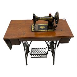 Singer - walnut and cast iron treadle sewing machine