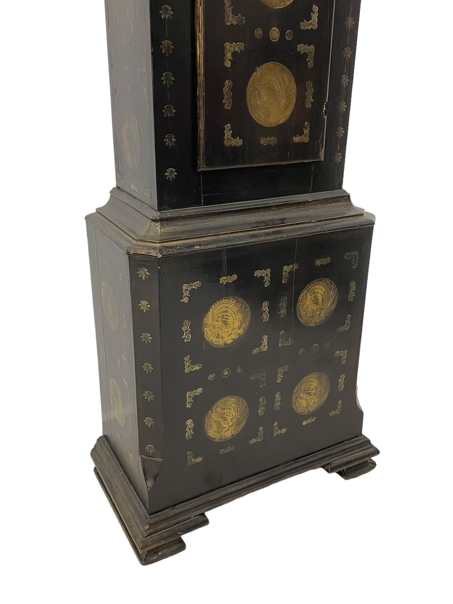 James Bowra of Sevenoaks Kent - 18th century 8-day ebonised longcase clock with gilt decoration c1740, with a flat top, dentil moulding beneath and shaped back splats, break arch hood door flanked by plain pilasters with wooden capitals, long trunk with a curved topped door, on a square plinth with canted corners and raised on a moulded base, brass dial with cast spandrels and a silvered 'Punch' automata to the arch, matted dial centre with seconds ring and date aperture, silvered chapter ring with Roman numerals, five minute Arabics, minute and quarter hour tracks, with matching steel hands and silvered makers name plate, rack striking movement with a recoil anchor escapement, striking the hours on a bell. With weights and pendulum.