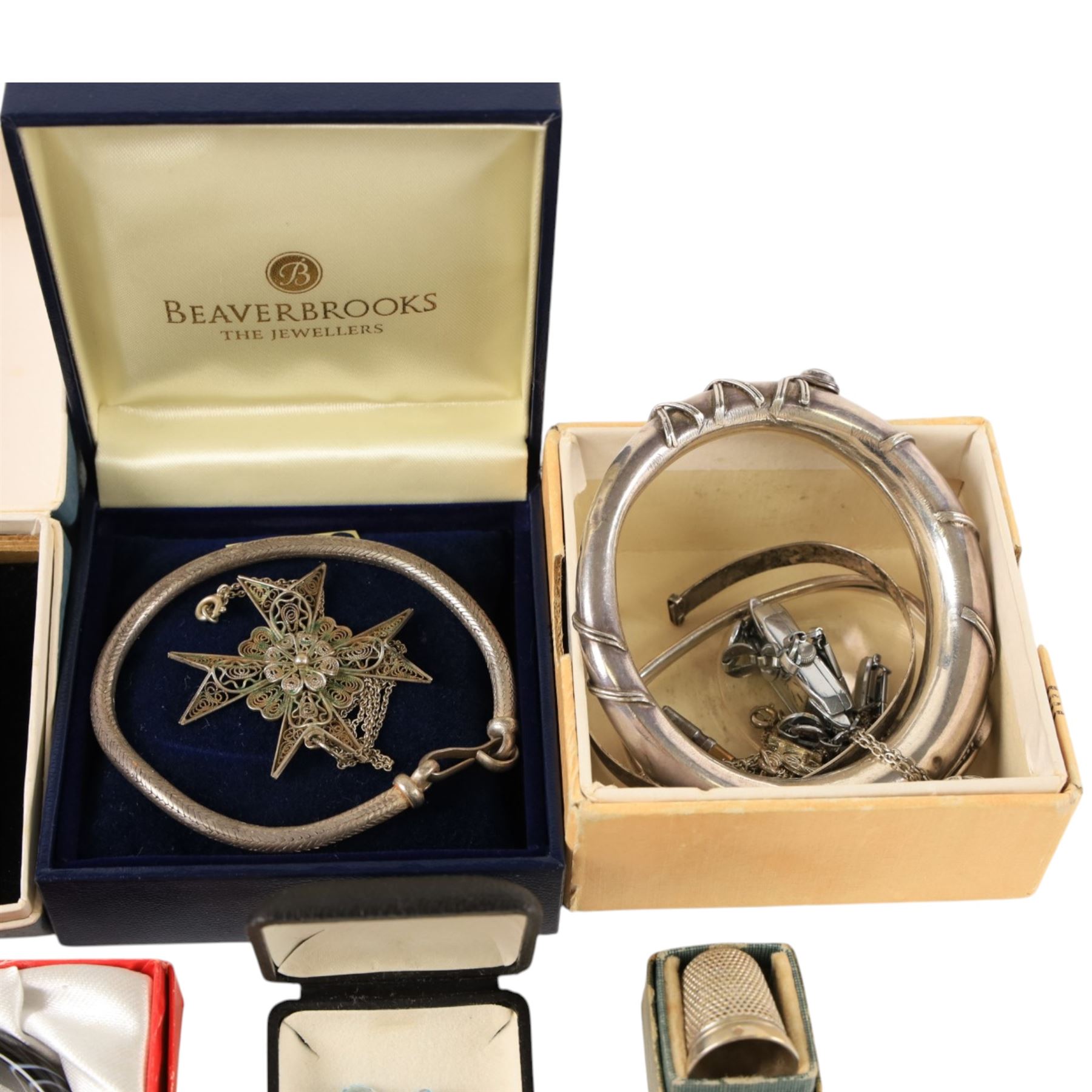 Silver jewellery, including bangles, heart locket, fob, silver thimble, costume jewellery and four loose stones