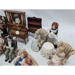 Dolls house drawing room furniture, including dressers, pink and green checked sofa and armchairs, bureau, chairs, piano, eight figures and a collection of afternoon tea miniatures