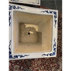 Chinese blue and white planter and stand, each of square slightly tapering and flared form, the planter decorated with two dragons and blossoming peonies, between stylised borders, the stand decorated with flower heads and vines, planter H30cm W29cm, stand H7cm D28.5cm