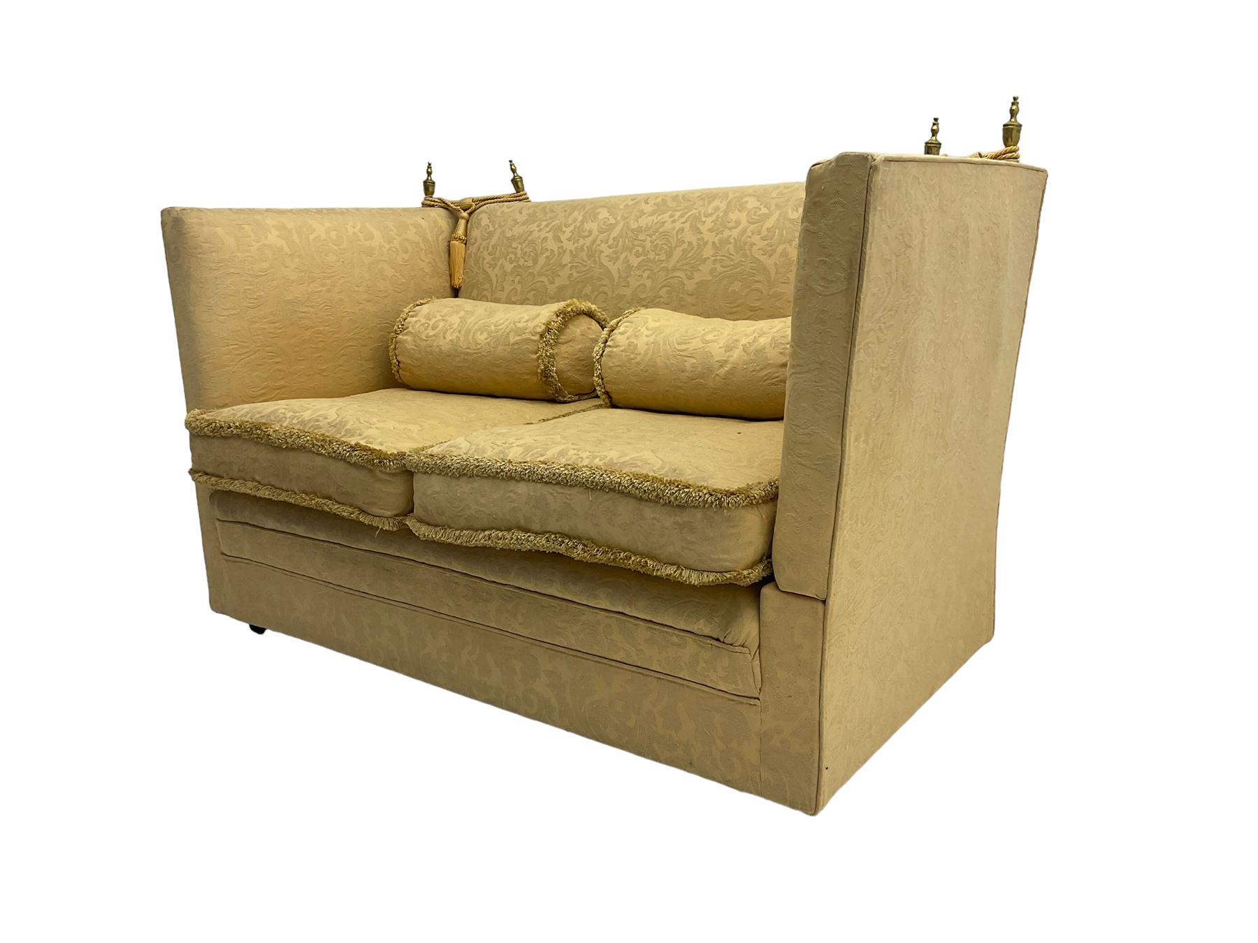 Edwardian knole design drop-arm two seat sofa, upholstered in yellow damask fabric with sprung back and seat and matching bolster cushions