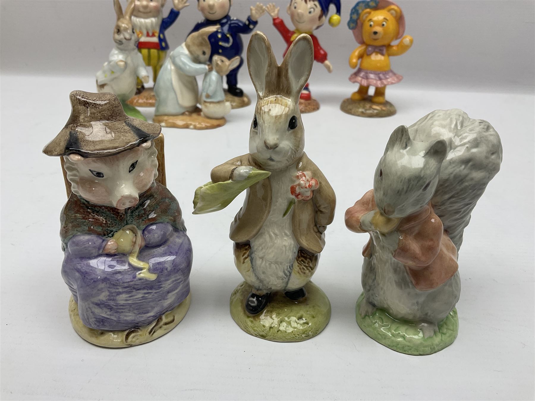Twelve Royal Albert Beatrix Potter figures, including Mr Alderman Ptolemy, Peter Rabbit and This Pig Had None, etc, some boxed, together with four Royal Worcester Noddy figures, including Big Ears and PC Plod, boxed
