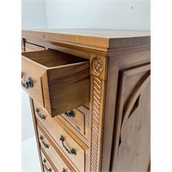 Gothic pine chest fitted with four short and four long drawers, rope twist carving, shaped bracket supports
