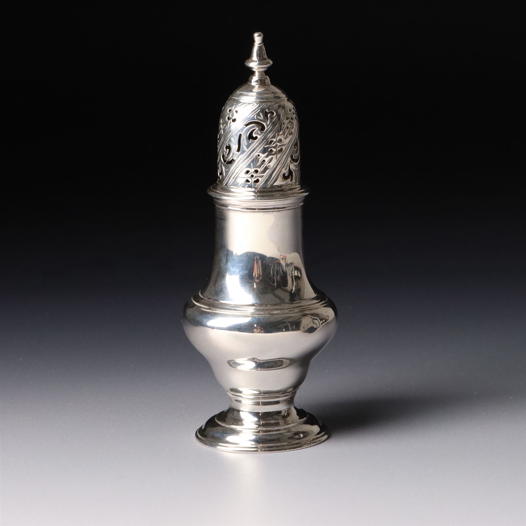 George II silver pounce pot of baluster form with engraved and pierced cover on a domed foot H13.5cm London 1757 Maker Jabez Daniell