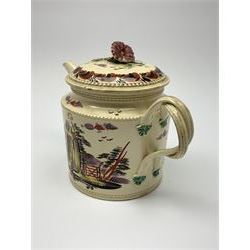 18th century creamware teapot, probably Leeds, with reeded entwined handle and floral finial to the cover, the body with hand painted polychrome decoration of figure to one side, and floral spray to the other, collectors paper label beneath inscribed Leeds Pottery, H11.5cm