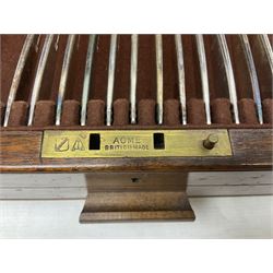 Elkington & Co part canteen of silver plated and stainless steel cutlery, to include simulated ivory handled examples, housed in oak and mahogany case, lock plate stamped 'Acme, British Made', W49cm D31cm H18cm