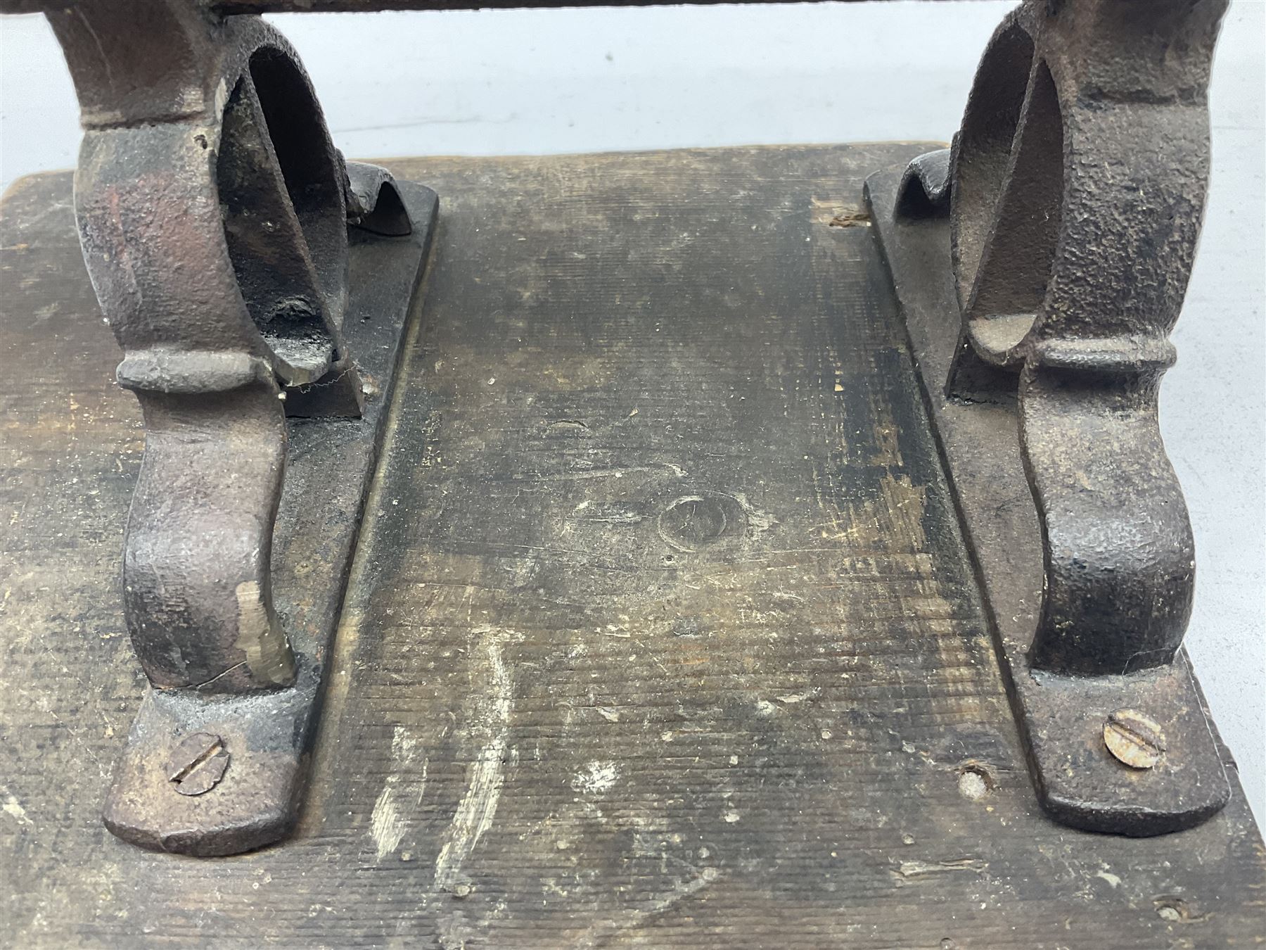 Victorian cuff and collar tabletop mangle, the ribbed brass rollers in a cast iron frame mounted on a wooden base