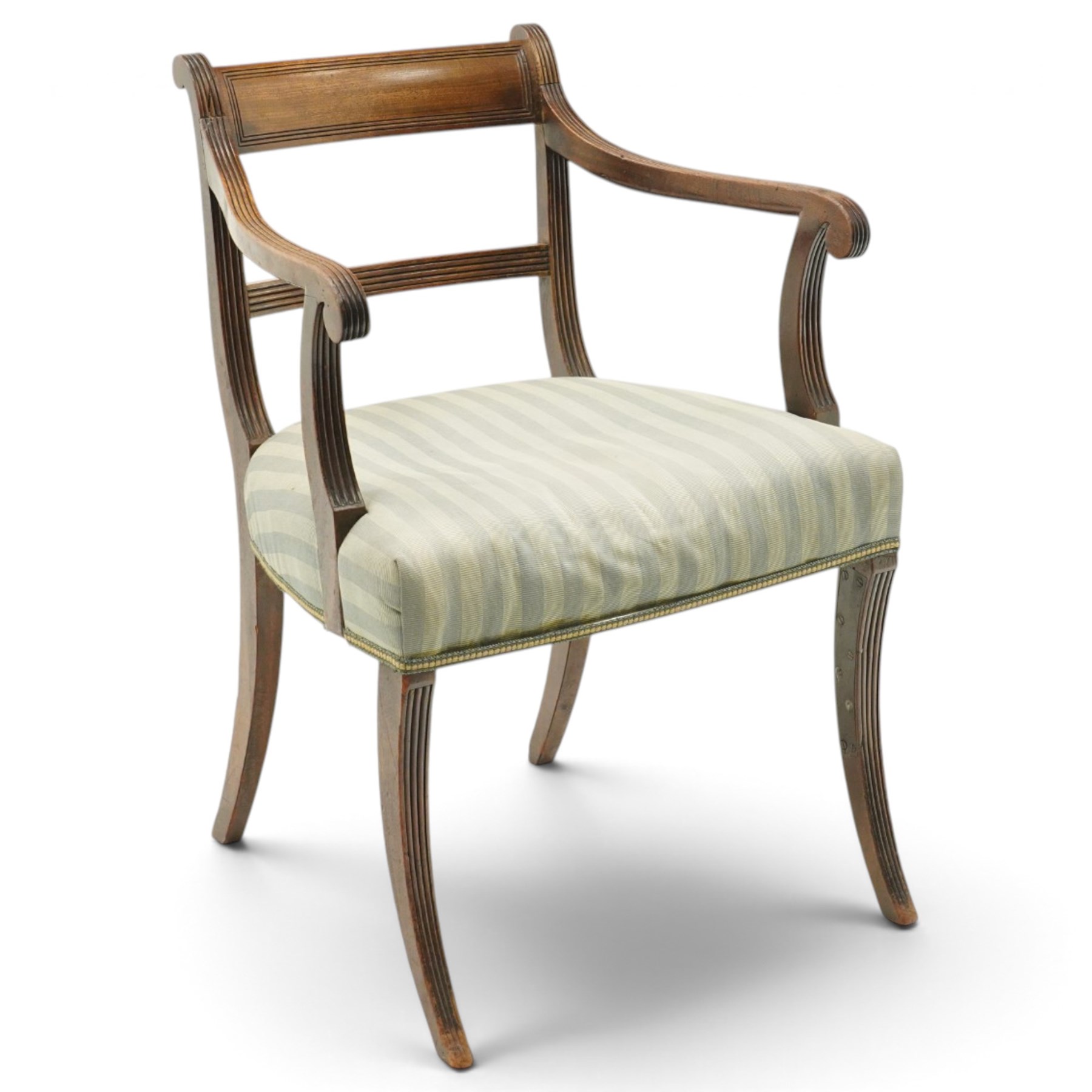 Georgian mahogany reeded carver armchair or elbow chair, bar back and scrolled arm terminals above over-stuffed seat, raised on sabre supports