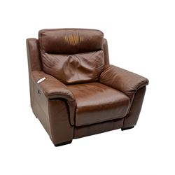 DFS - 'Liaison' reclining armchair upholstered in brown leather, upholstered in tan leather with stitched panel backrest and generously cushioned seat and arms, operated by wired remote, raised on block feet