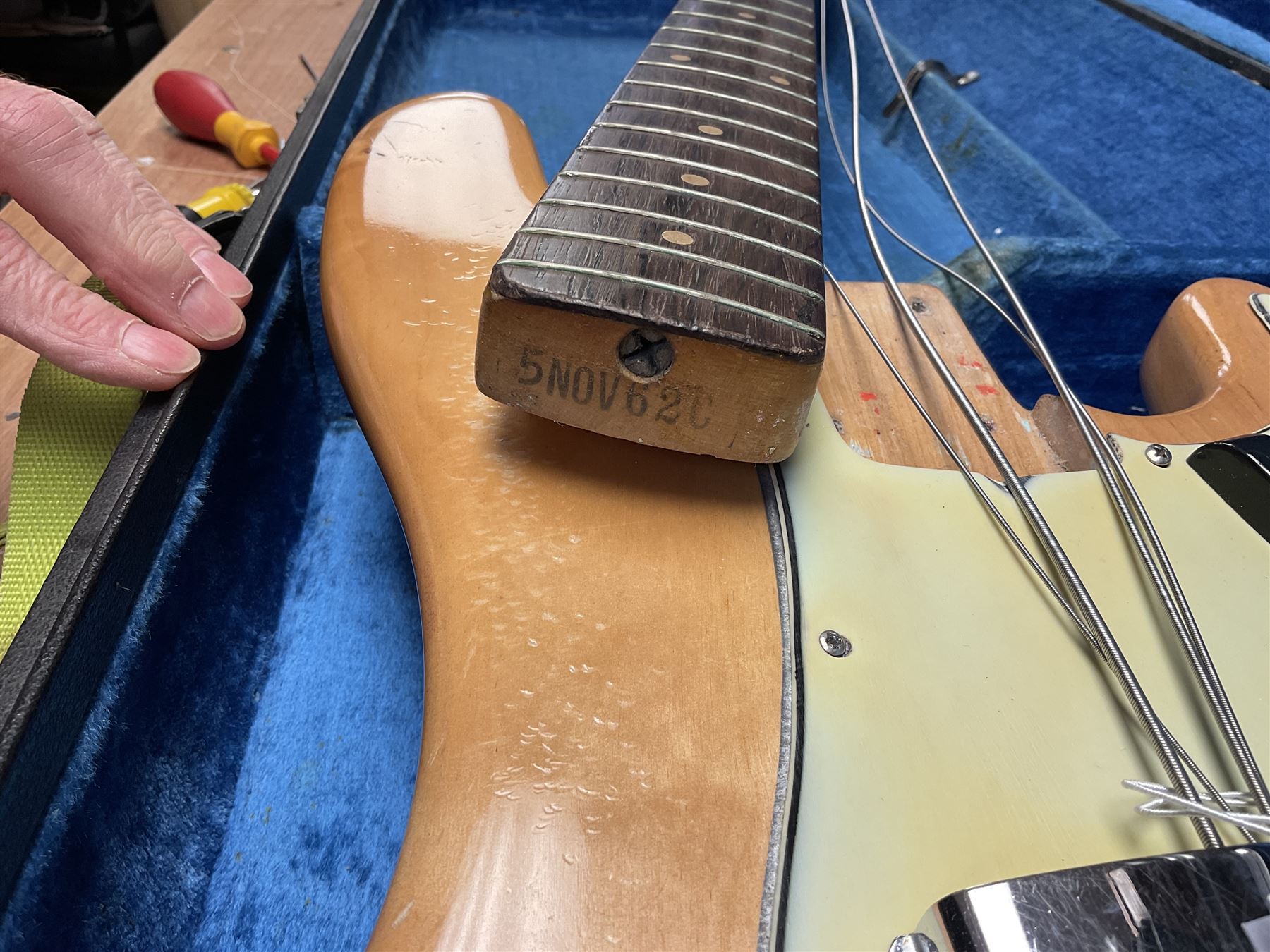 1962 Fender Precision bass guitar; re-finished in natural alder in the 1970s; impressed date code 5NOV62C to end of neck and serial no.90537 to back plate; L115.5cm; in replacement hard carrying case