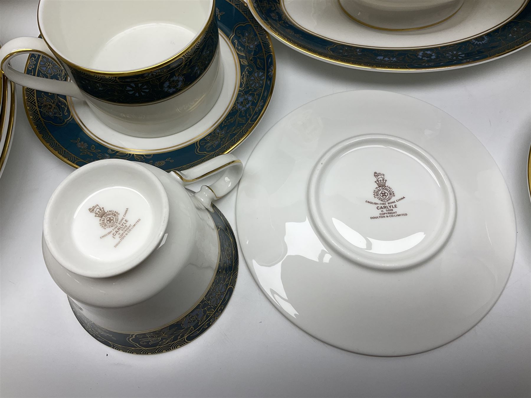 Royal Doulton Carlyle pattern tea and dinner service for six, to include teapot, coffee pot, teacups and saucers, coffee cups and saucers, milk jug, open sucrier, dinner plates, side plates, bowls, soup bowls, to covered dishes etc (64) 