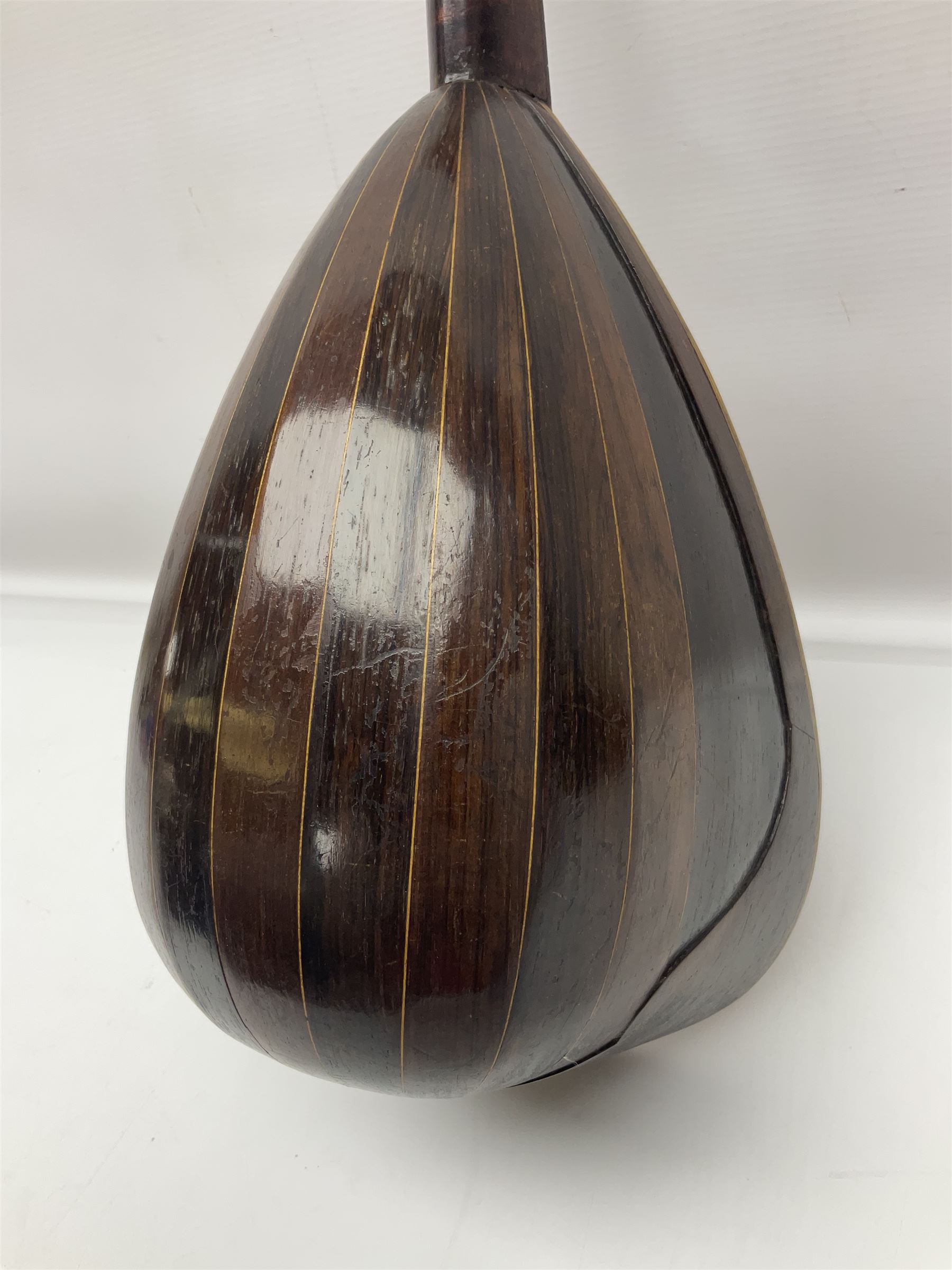 Late 19th century Italian lute back mandolin with segmented bowl back, bears label Gennaro Maglioni Napoli L61cm; in ebonised wooden case; together with another similar damaged Italian lute back mandolin for restoration or spares (2)