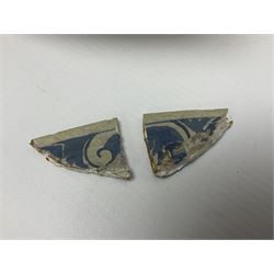 Early 18th century Delft marriage plate, of circular form with dished centre, the centre inscribed and dated 'Thomas and Elizabeth Kockerill Bridlington Key 1715' within a crowned C scroll cartouche, flanked by demi-griffins, above a putto head and tassels, within a wide foliate border, D34cm
