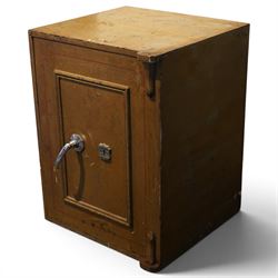 Early 20th century painted iron and steel safe, square form with moulded panel door, applied handle and lock plate with three keys, the interior fitted with twin cash drawers with recessed handles, on low cast feet